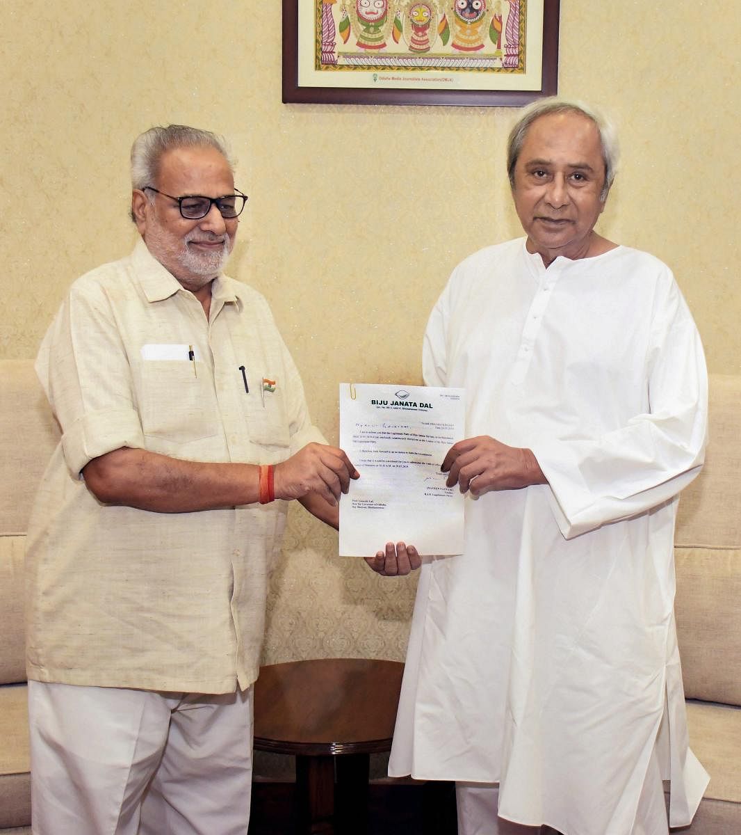 Chief Minister Naveen Patnaik meets Odisha Governor Ganeshi Lal to stake claim to form the new government in the state, at Raj Bhawan in Bhubaneswar. PTI Photo