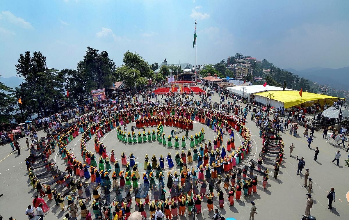 Anganwadi workers perform Naati dance during a rally to create awareness on saving 'girl child' on the first day of the Shimla Summer Festival 2019 at Ridge in Shimla. (PTI Photo)