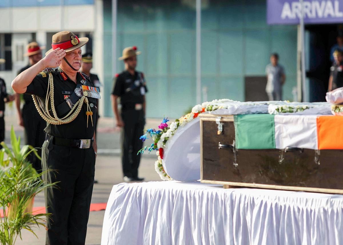 Chief of the Army Staff General Bipin Rawat pays tributes to the mortal remains of Lance Naik Mohammad Jawed, in New Delhi, Tuesday, June 11, 2019. Jawed was killed when Pakistani troops resorted to unprovoked ceasefire violation on the Line of Control in Jammu and Kashmir’s Poonch district. (PTI Photo)