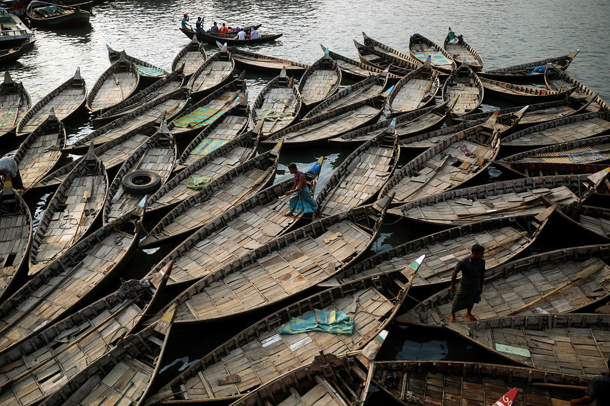 Boats are anchored at the bank of the river Buriganga which are used to carry passengers crossing the river in Dhaka, Bangladesh, June 12, 2019. REUTERS/Mohammad Ponir Hossain