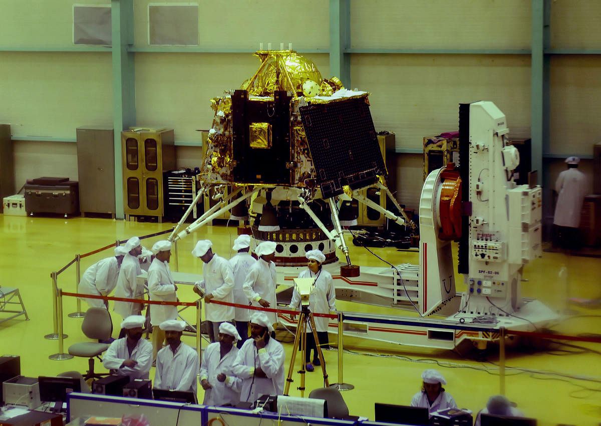 ISRO personnel work on the orbiter vehicle of Chandrayaan-2, India's first moon lander and rover mission planned and developed by ISRO at ISRO Satellite Integration and test establishment (ISITE), in Bengaluru, Wednesday, June 12, 2019. (PTI Photo/Shailendra Bhojak)