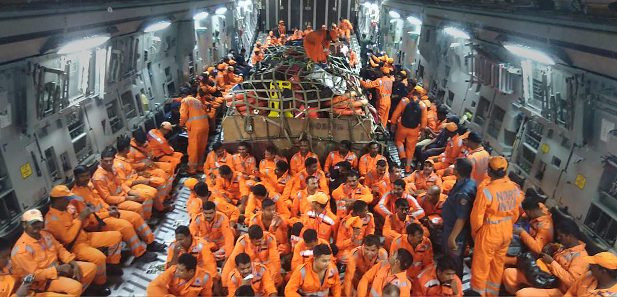 NDRF members seen inside the IAF C-17 aircraft as it lands at Jamnagar, in Gujarat, Wednesday, June 12, 2019. The NDRF team will carry out rescue and relief missions in Gujarat, for those affected by Cyclone Vayu. (PTI Photo)