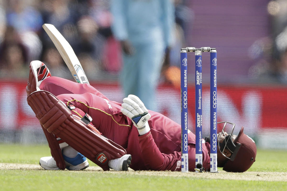 West Indies' Shimron Hetmyer lies back on the pitch after ducking a bouncer during the Cricket World Cup match between England and West Indies at the Hampshire Bowl in Southampton, England, Friday, June 14, 2019. AP/PTI
