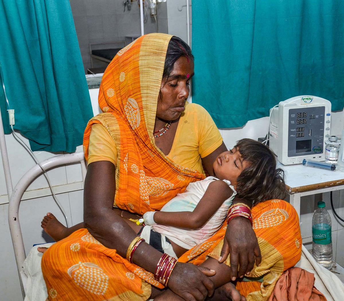 A child showing symptoms of Acute Encephalitis Syndrome (AES) being treated at a hospital in Muzaffarpur, Friday, June 21, 2019. AES which has claimed more than 100 lives in Bihar's Muzaffarpur region, is a serious neurological illness that causes inflammation of the brain. (PTI Photo)