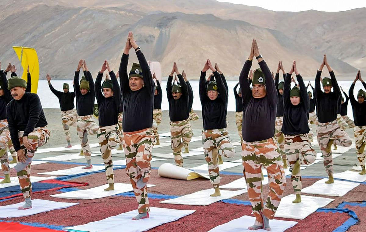 DG ITBP SS Deswal practices yoga along with the jawans, at the height of approx 14,000 ft near Lukung, at the banks of Pangong Tso, on the occasion of the 5th International Day of Yoga 2019, in Ladakh, Friday, June 21, 2019. (PIB/PTI Photo)