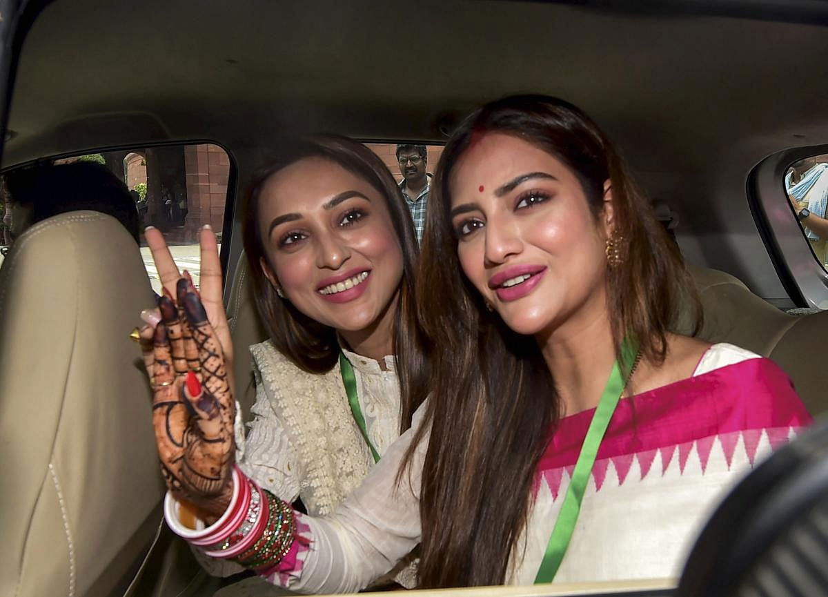 Actors and Trinamool Congress (TMC) MPs Mimi Chakraborty and Nusrat Jahan (R) at Parliament House complex during the Budget Session, in New Delhi, Tuesday, June 25, 2019. (PTI Photo)
