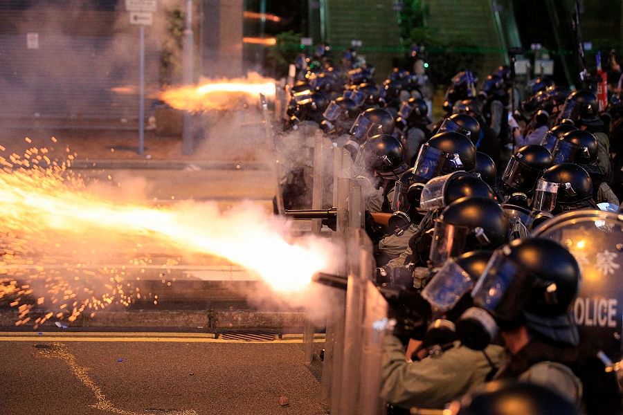Hong Kong police fire tear gas at protesters in Sai Wan, Hong Kong. (PTI)