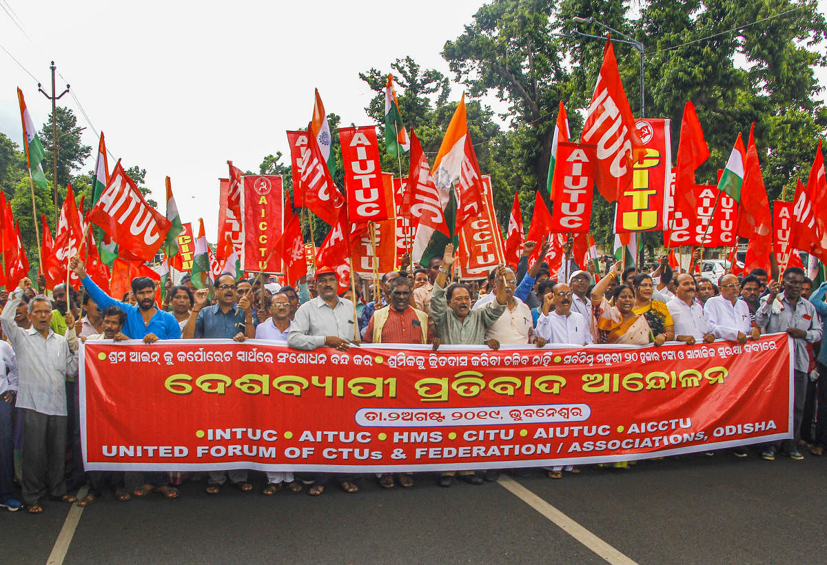 Members of Central Trade Union and Employees Federation stage a protest in front of Odisha Assembly over the anti-labour policy & labour code bills, in Bhubaneswar. PTI