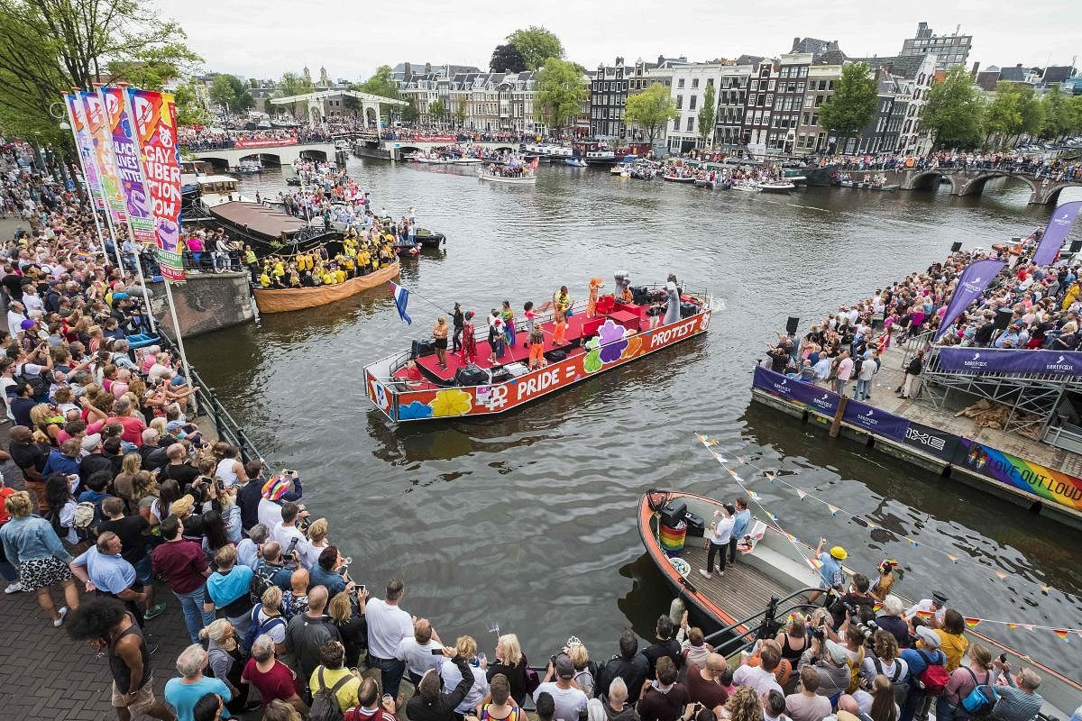 A general view shows people taking part in the annual Canal Parade, a boat parade part of the Amsterdam Gay Pride AFP Photo