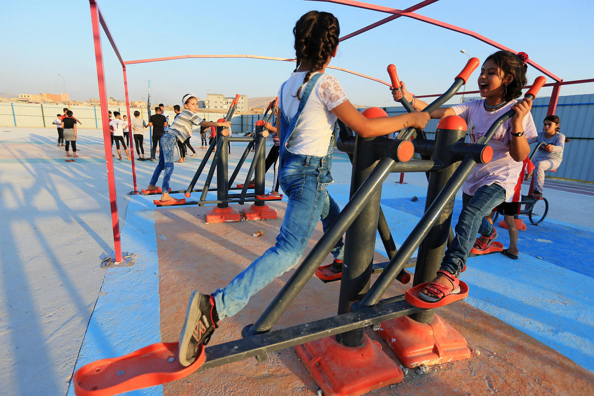 Displaced Iraqi children from the minority Yazidi sect, who fled the Iraqi town of Sinjar, play at Sharya camp on the outskirts of Duhok province. (Reuters Photo)