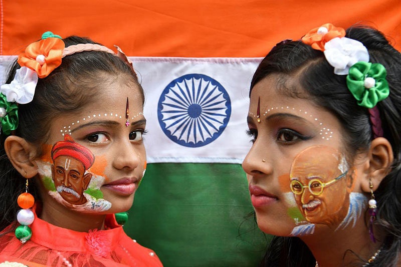 Siblings pose for a picture with their face painted depicting Indian freedom fighters Bala Gangadhara Tilak (L) and Mahatma Gandhi during the India's 73rd Independence Day, August 15, 2019. (Photo: AFP)