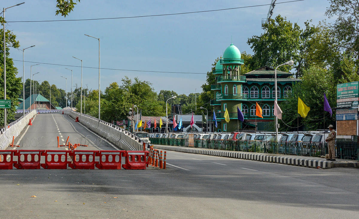 A view of a blocked road during restrictions following the abrogation of the provisions of Article 370, in Srinagar, Friday, Aug 16, 2019. (PTI Photo)