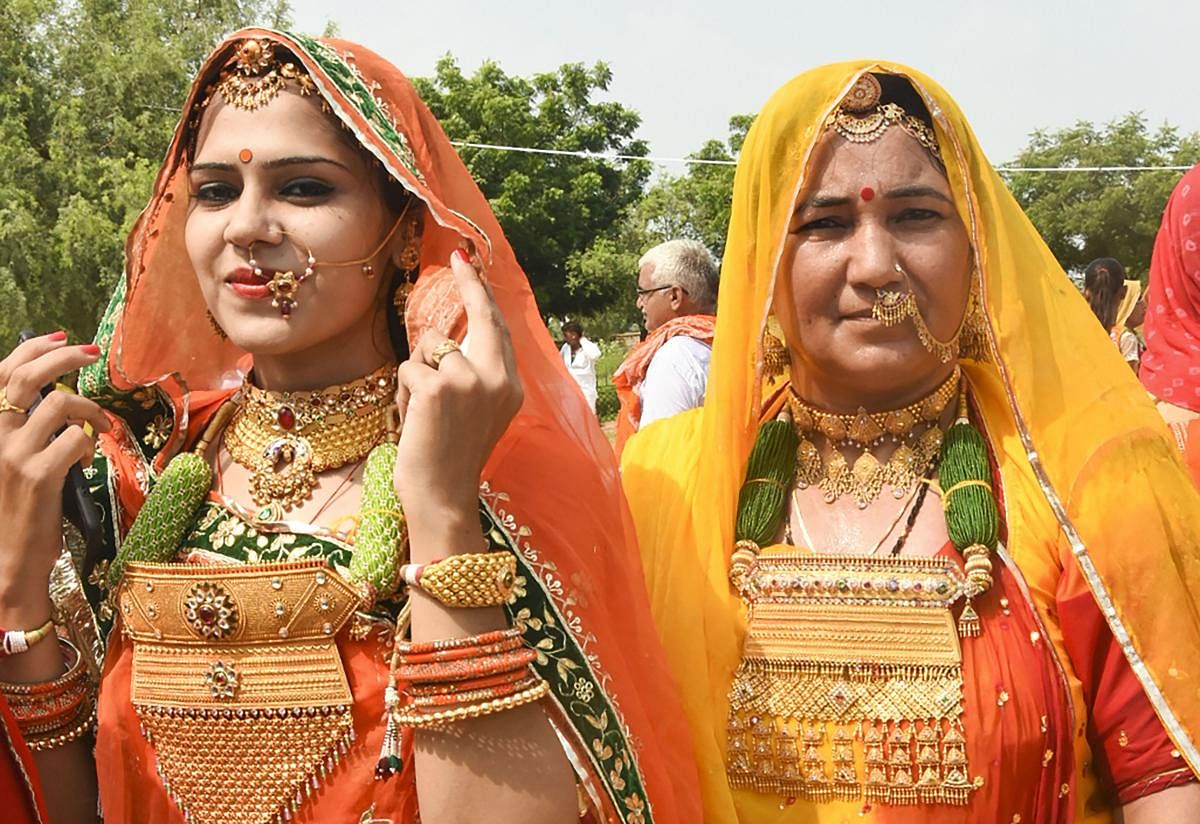Bishnoi community women during a fair to offer tribute to legendary nature lover Amrita Devi Bishnoi and other martyrs, at Khejarli village in Jodhpur, Sunday, Sept 19, 2018. (PTI Photo)