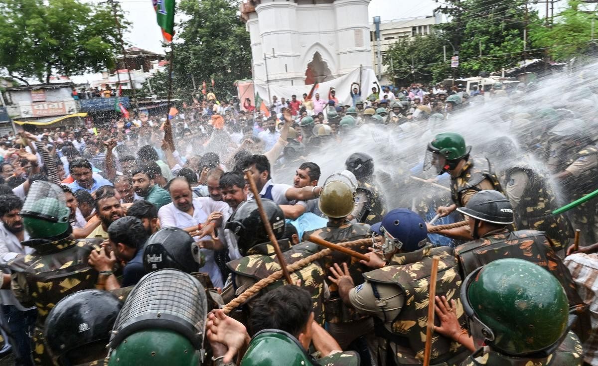 Police personnel use water cannons to disperse the leader of opposition in Madhya Pradesh Gopal Bhargava and BJP workers during their 'Ghanta Agitation' against state Chief Minister Kamal Nath, in Jabalpur. PTI