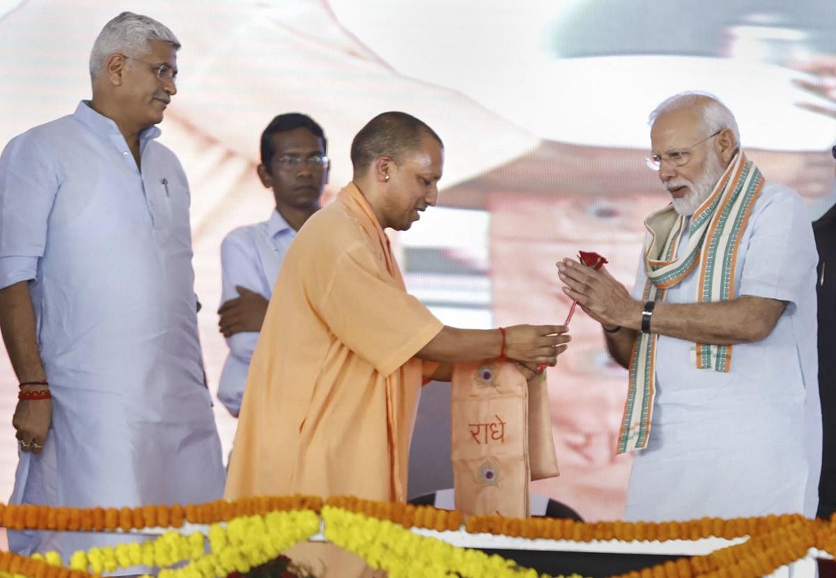 Prime Minister Narendra Modi and Uttar Pradesh Chief Minister Yogi Adityanath during launch of National Animal Disease Control Programme for eradication of Foot and Mouth Disease and Brucellosis in livestock, in Mathura. PTI