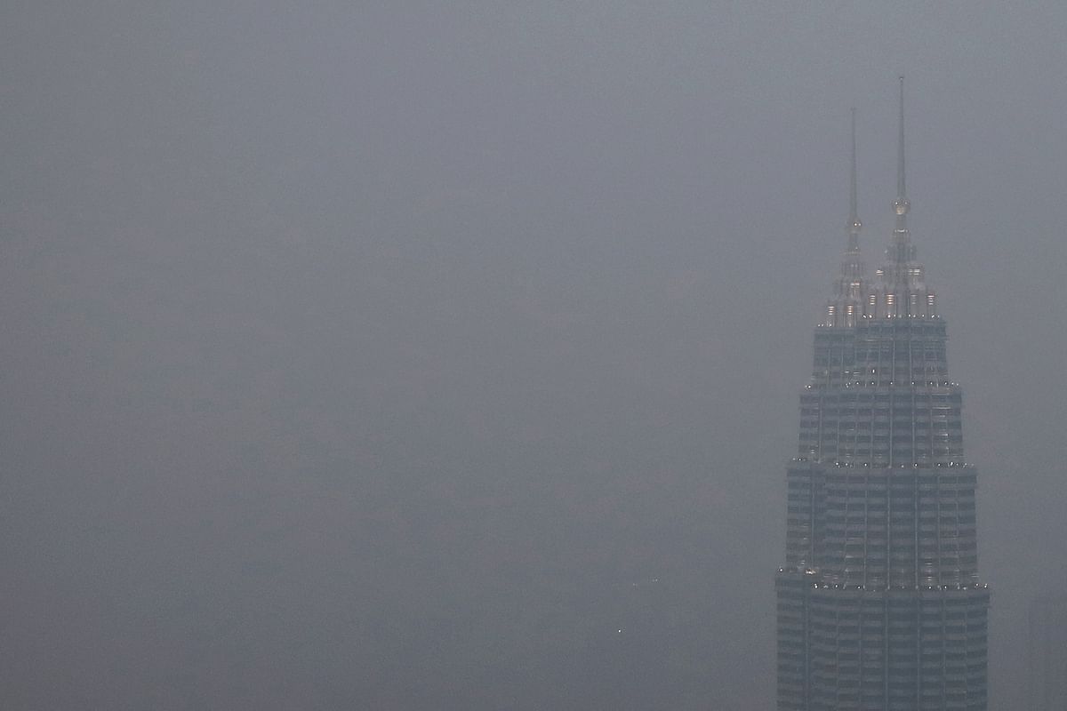 Petronas Twin Towers shrouded by haze in Kuala Lumpur, Malaysia