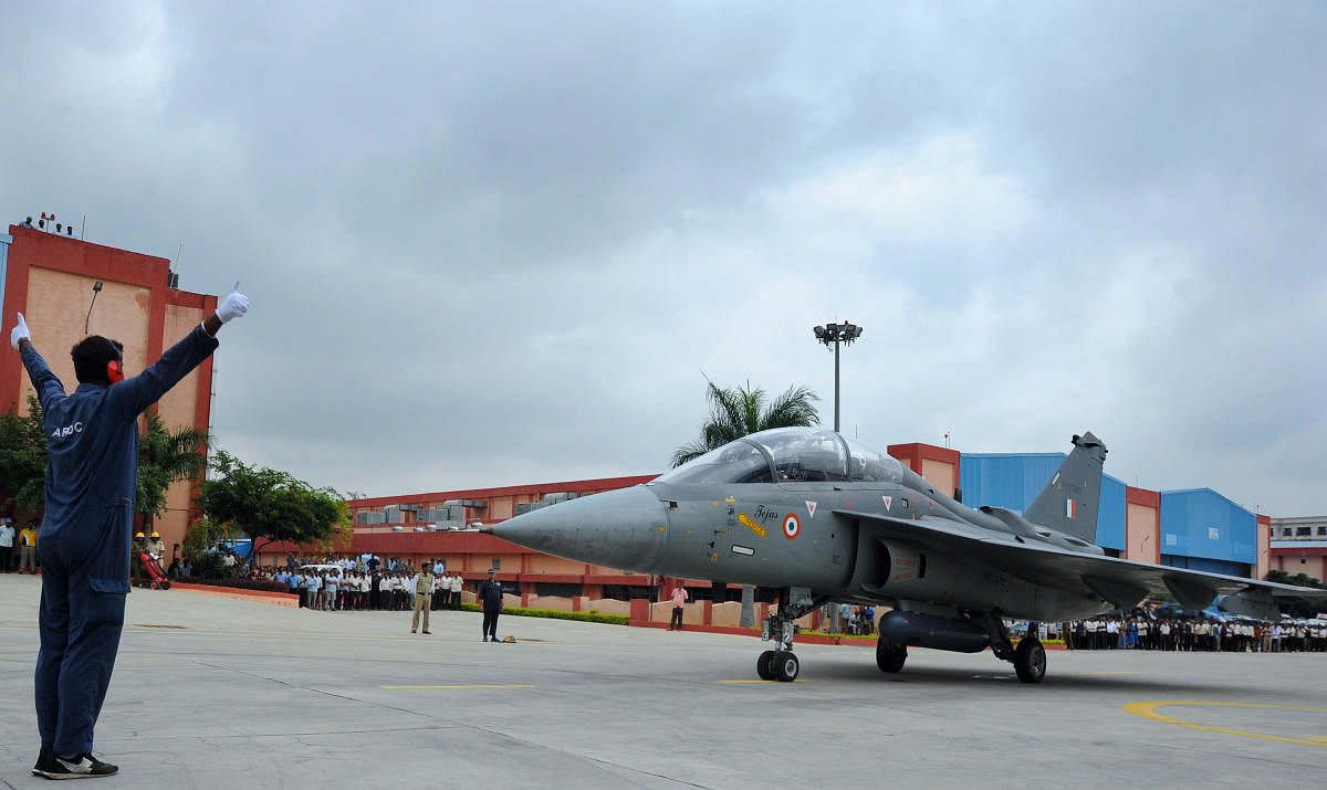 Defence Minister Rajnath Singh prepares to fly in the Tejas fighter aircraft from the HAL airport in Bengaluru on Thursday. (DH Photo/Pushkar V)