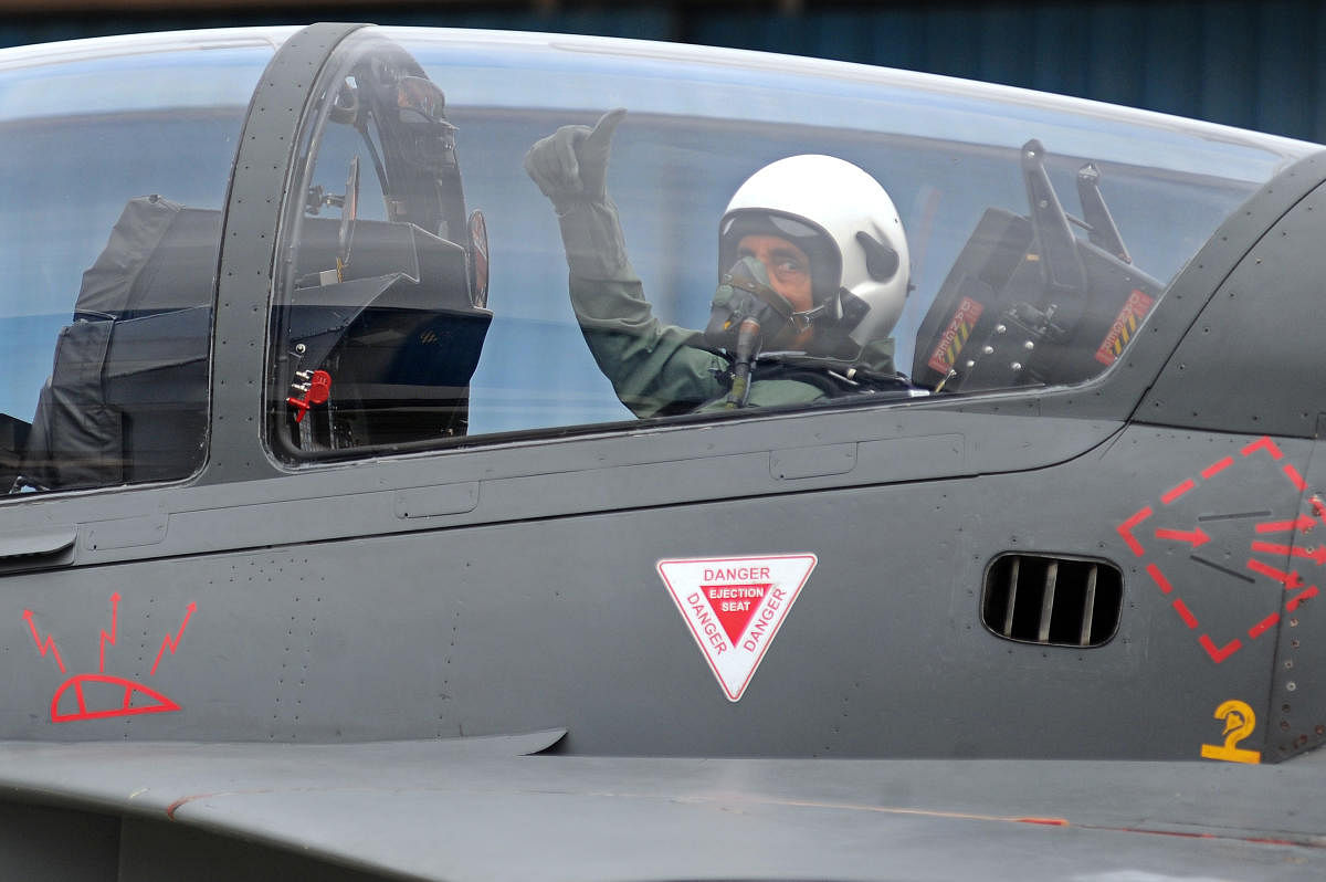 Defence Minister Rajnath Singh prepares to fly in the Tejas fighter aircraft from the HAL airport in Bengaluru on Thursday. (DH Photo/Pushkar V)