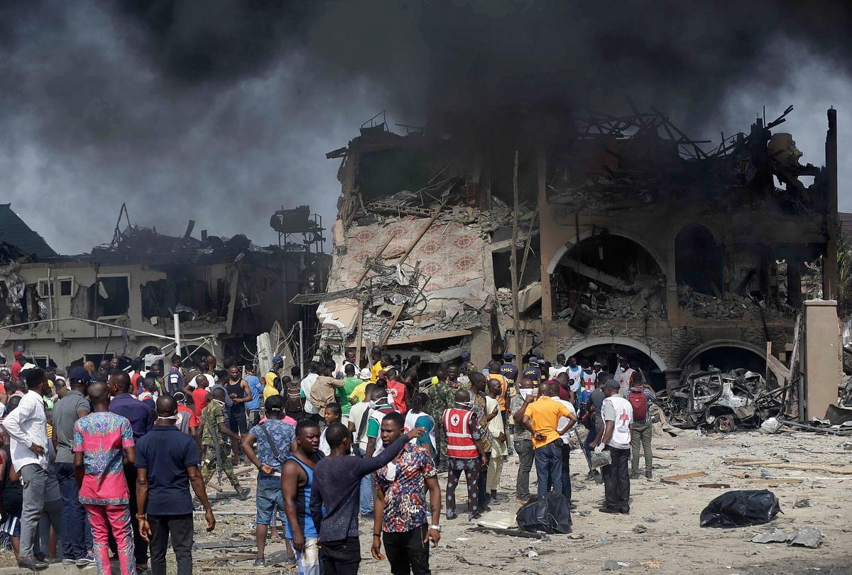 People gather near the site of an explosion in Lagos, Nigeria. (Credit: AP/PTI)