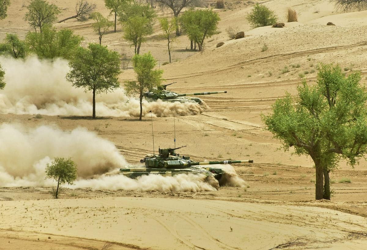 Troops of the Indian Army's South Western Command during 'Vijay Prahar' military exercise at Mahajan Field Firing Range near Bikaner in Rajasthan on Wednesday. PTI