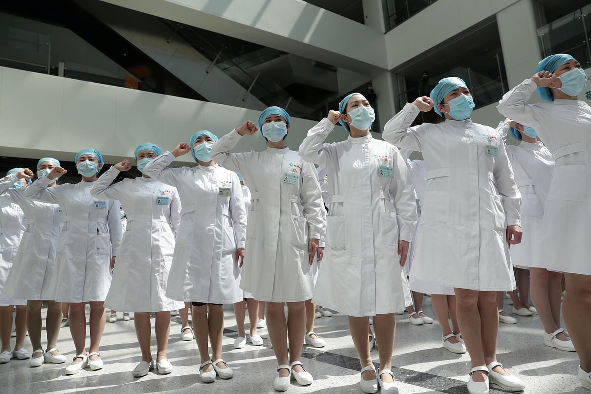 Nurses wearing face masks take part in an event held to mark the International Nurses Day, at Wuhan Tongji Hospital in Wuhan, the Chinese city hit hardest by the coronavirus disease (COVID-19) outbreak, in Hubei province. (Reuters photo)