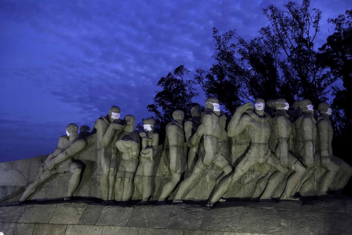 Statues of the Monumento das Bandeiras are seen with face masks during the spread of the coronavirus disease (COVID-19) in Sao Paulo, Brazil. (Reuters photo)