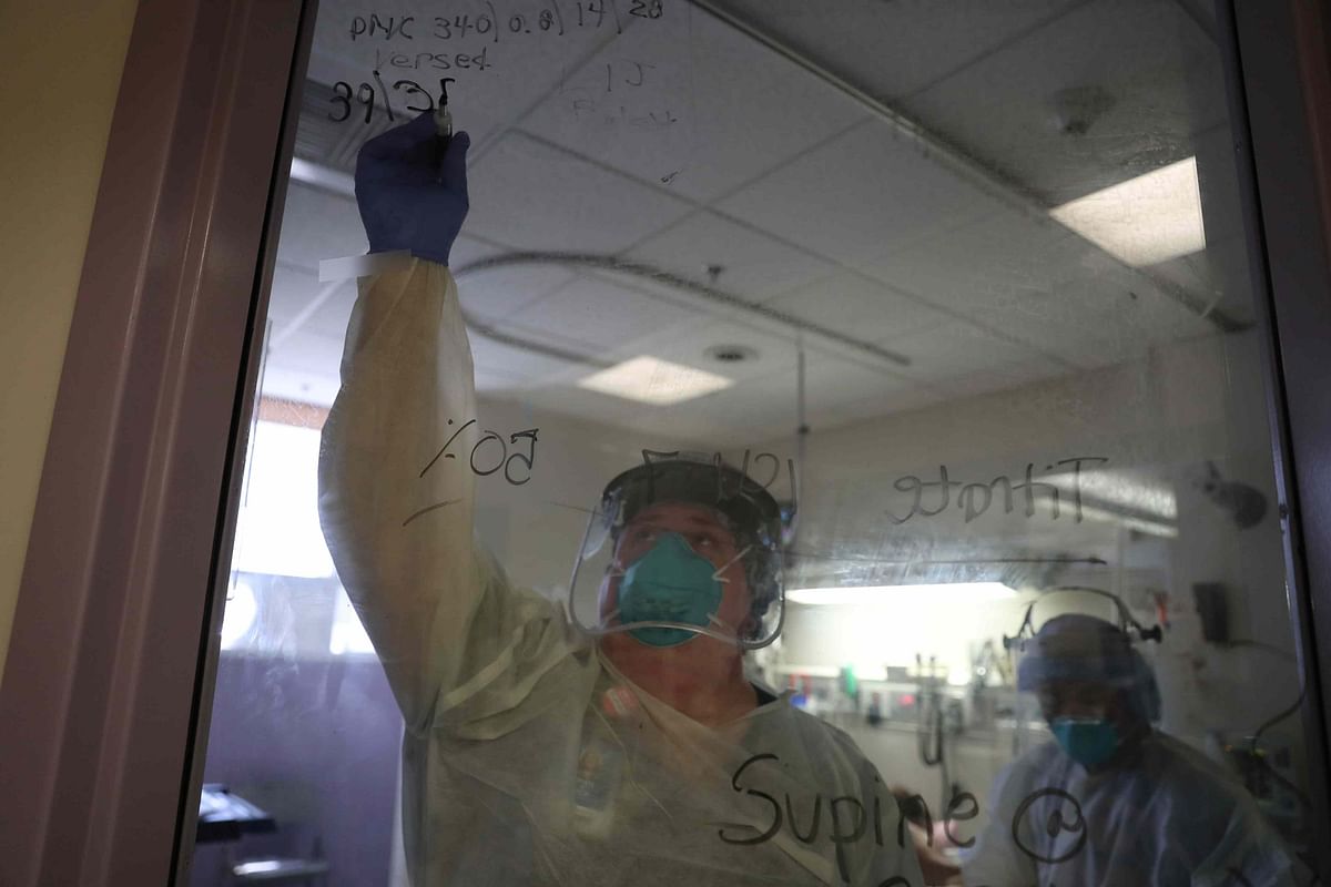 Medical staff leave notes on a window about treatment they gave a patient suffering from the coronavirus disease (COVID-19) in the Intensive Care Unit (ICU), at Scripps Mercy Hospital in Chula Vista, California. (Reuters)