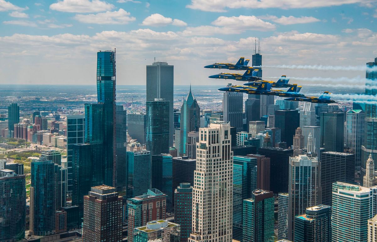 his handout image courtesy of the US Navy shows the U.S. Navy Flight Demonstration Squadron, the Blue Angels honoring frontline COVID-19 first responders and essential workers with formation flights over Chicago. (AFP)