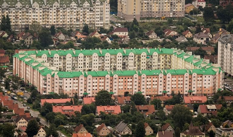 An aerial photo taken on August 27, 2017 shows an apartment complex in Kaliningrad. Kaliningrad Stadium will host several games of the FIFA World Cup 2018. AFP Photo