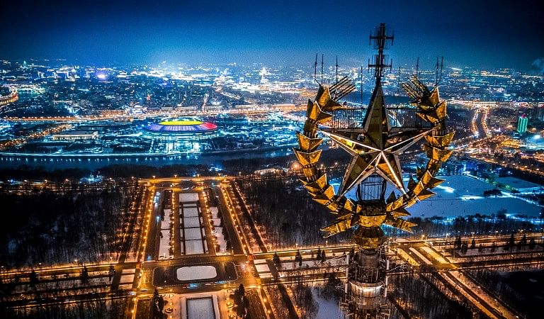 An aerial view taken with a drone in Moscow on January 27, 2018 shows a star on top of the Moscow State University, Luzhniki Stadium and the Moskva River. AFP Photo