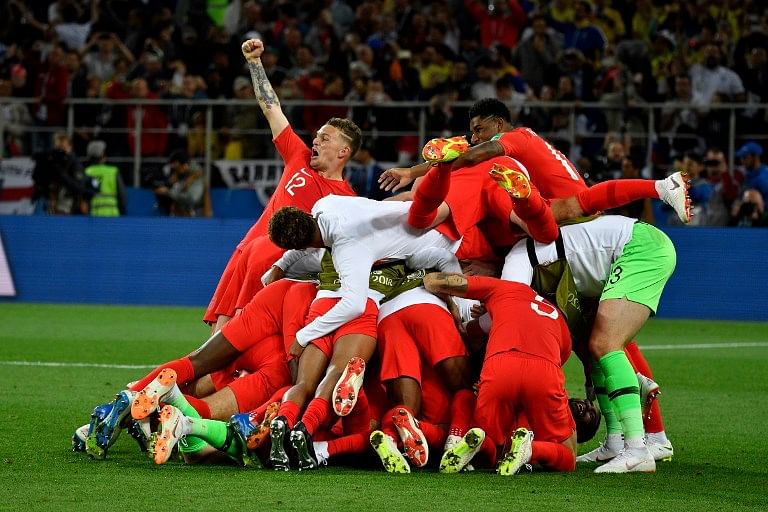 England's players celebrate winning the penalty shootout at the end of the Russia 2018 World Cup round of 16 football match between Colombia and England at the Spartak Stadium in Moscow on July 3, 2018.  Alexander NEMENOV / AFP