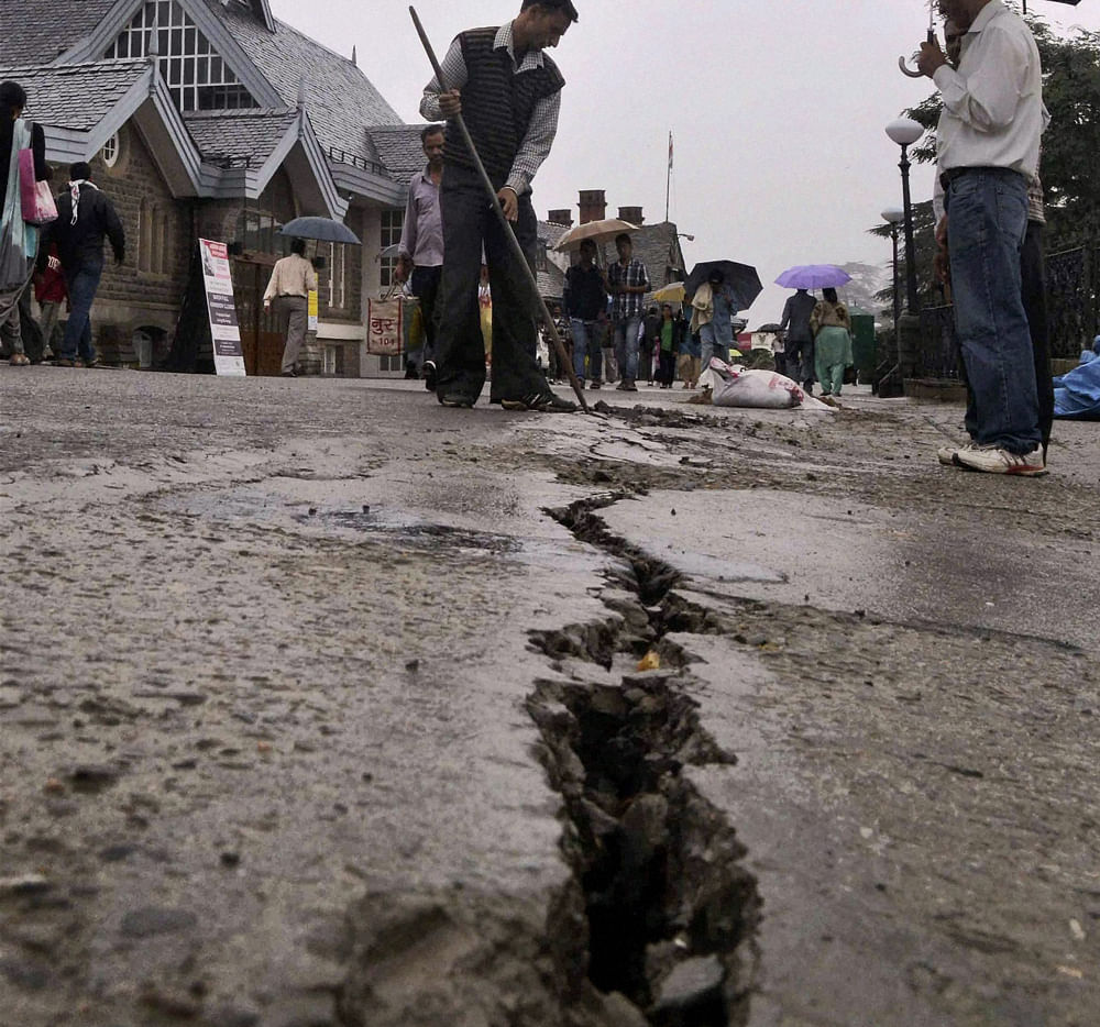 Shimla: Cracks appear on a ridge in Shimla as rains continued to lash the city on Monday. PTI Photo