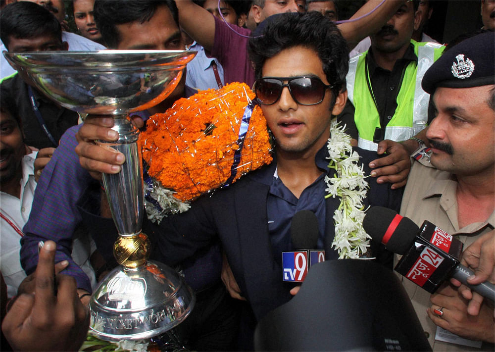 Mumbai: Under-19 Team India captain Unmukt Chand being welcomed on his arrival at the airport in Mumbai on Tuesday. PTI Photo by Mitesh Bhuvad
