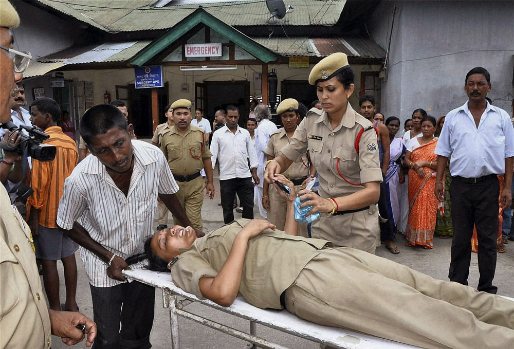 Tezpur: A female police official being admitted in a hospital after she was attacked by All Assam Minority Students' Union members in Tezpur in Assam on Monday. PTI Photo