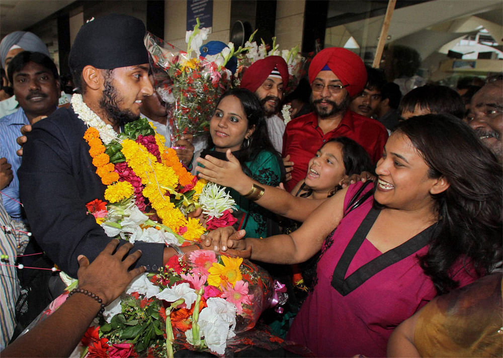 Mumbai: Under-19 Team India player Harmeet Singh Baddan being welcomed on his arrival at the airport in Mumbai on Tuesday. PTI Photo by Mitesh Bhuvad(