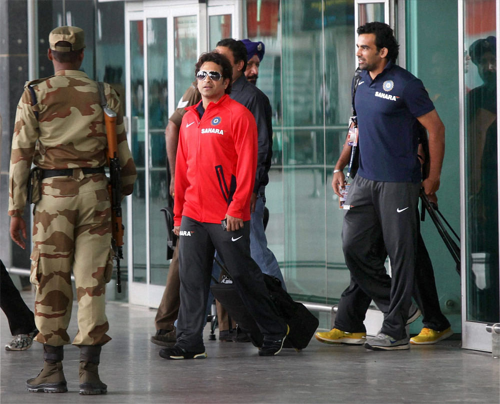 Bengaluru: Cricketers Sachin Tendulkar and Zaheer Khan on their arrival at the airport in Bengaluru on Tuesday for the second test match against New Zealand. PTI Photo by Shailendra Bhojak