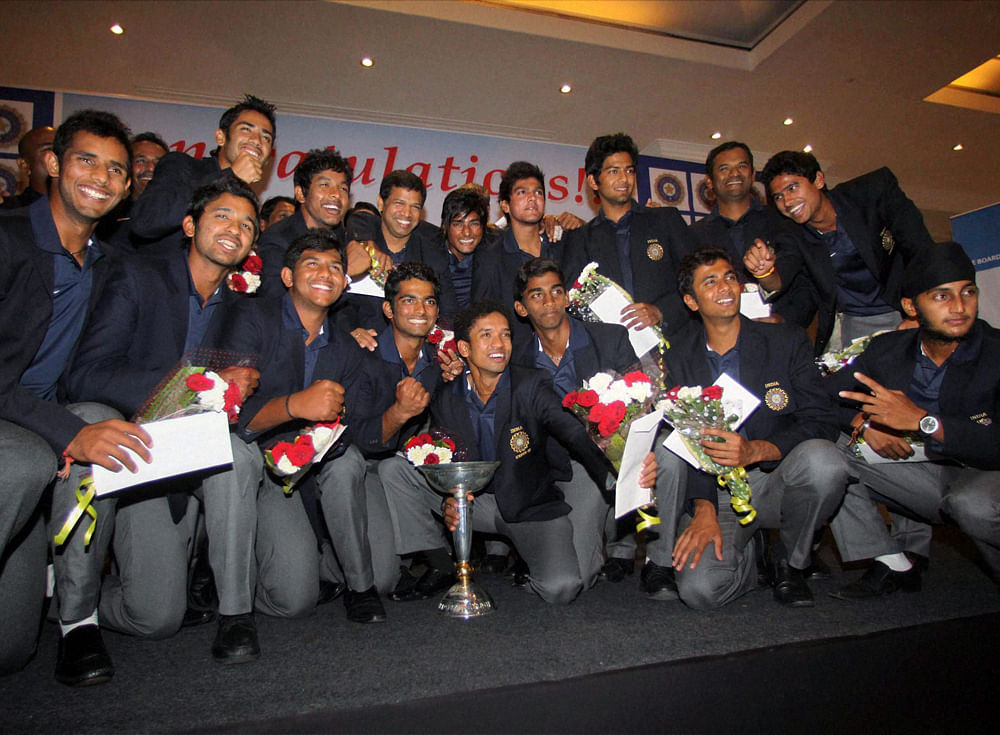 Under-19 World Cup winning team members pose for a photograph during a felicitation ceremony in Mumbai on Tuesday. PTI