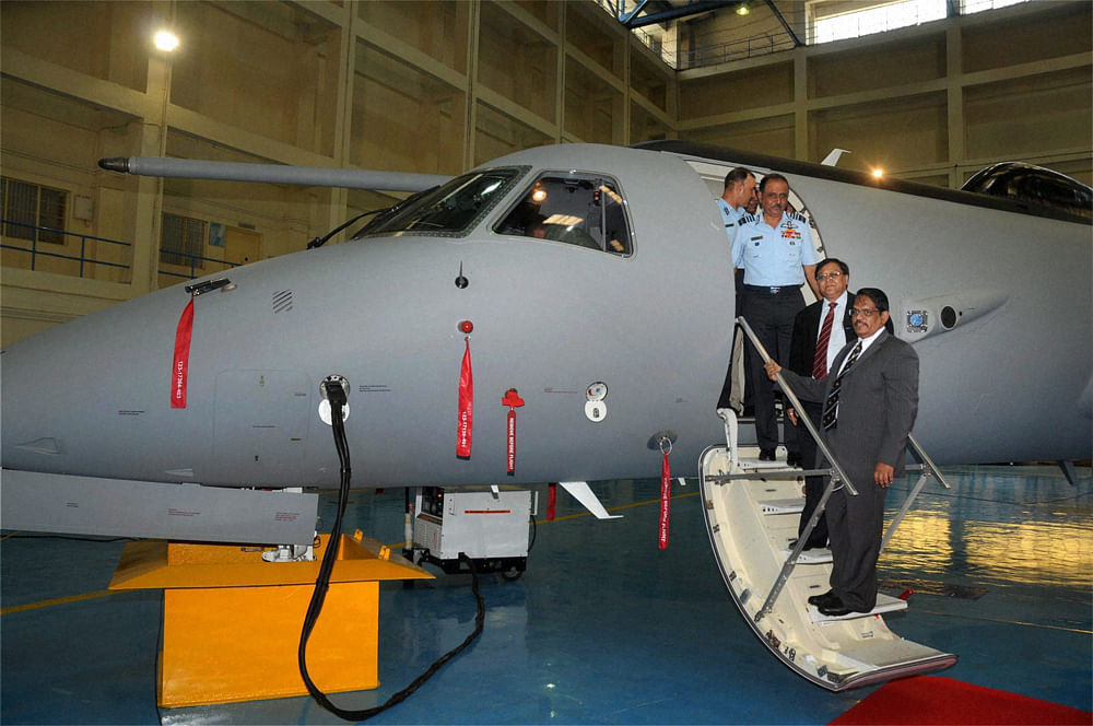 Air Chief Marshal NAK Browne with DRDO Director General V K Saraswat and  D G Elangovan, Chief Controller R & D, during a function of  modified, EMB-145 aircraft of the AEW&C programme in Bengaluru on  Thursday.  PTI