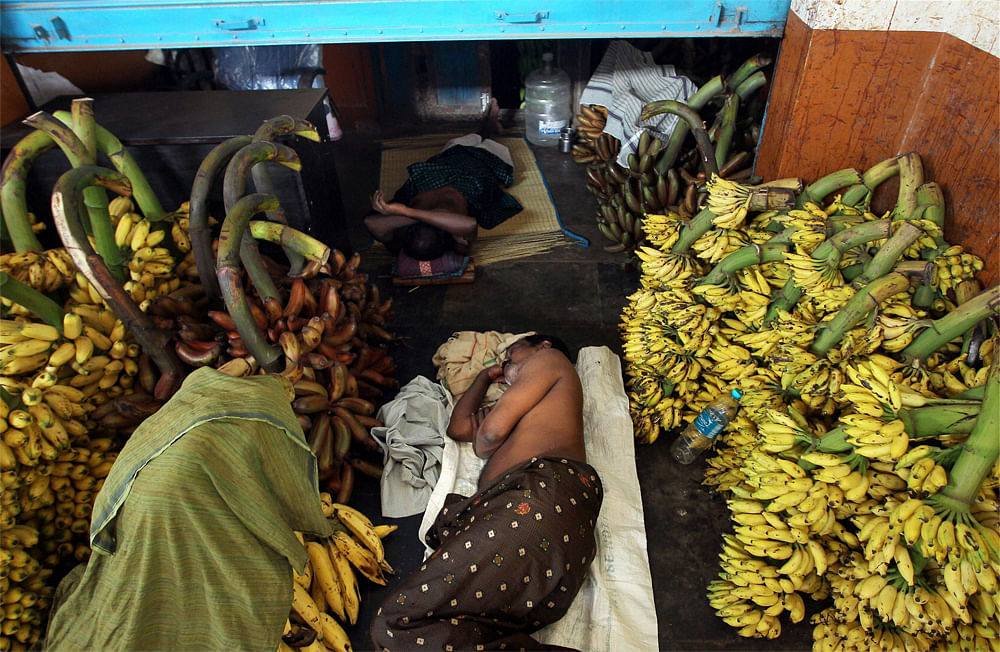 Workers take rest at their shop at Koyambedu market in Chennai during  Bharat bandh protest over FDI in retail and fuel price hike on Thursday.  PTI
