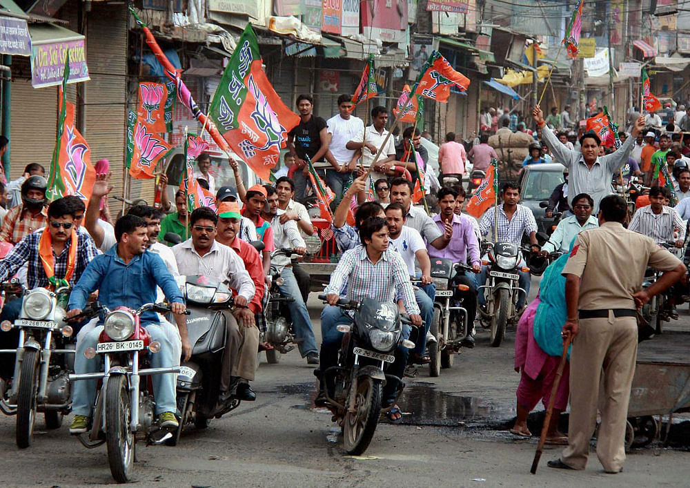 BJP activists take out a bike rally during their protest against FDI in retail and fuel price hike in Gurgaon on Thursday. PTI