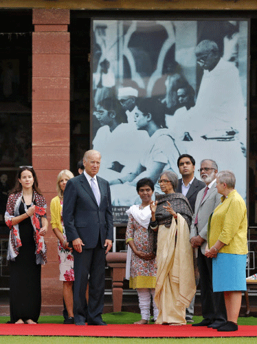 U.S. Vice President Joe Biden (3rd L) listens to Tara Gandhi (4th R),  the granddaughter of Mahatma Gandhi, as he arrives to pay homage at the  Mahatma Gandhi memorial at Gandhi Smriti, in New Delhi July 22, 2013.  Biden is on a four-day visit to Ind...