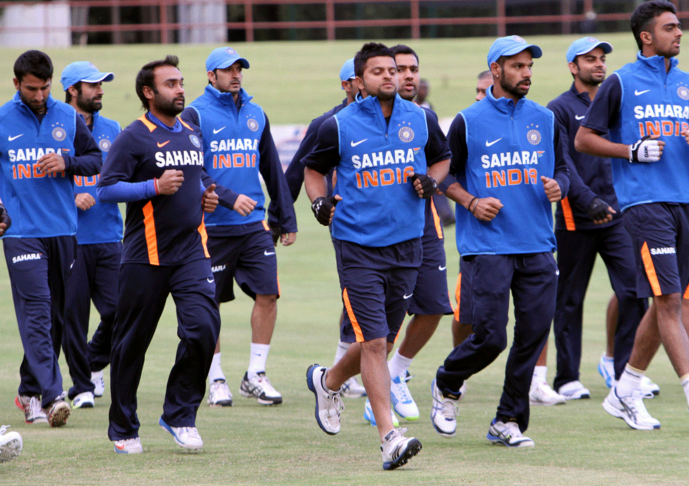 Indian Cricket players are seen during a practice session in Harare, Monday, July, 22, 2013. India and Zimbabwe will play a one day cricket match Wednesday. (AP Photo