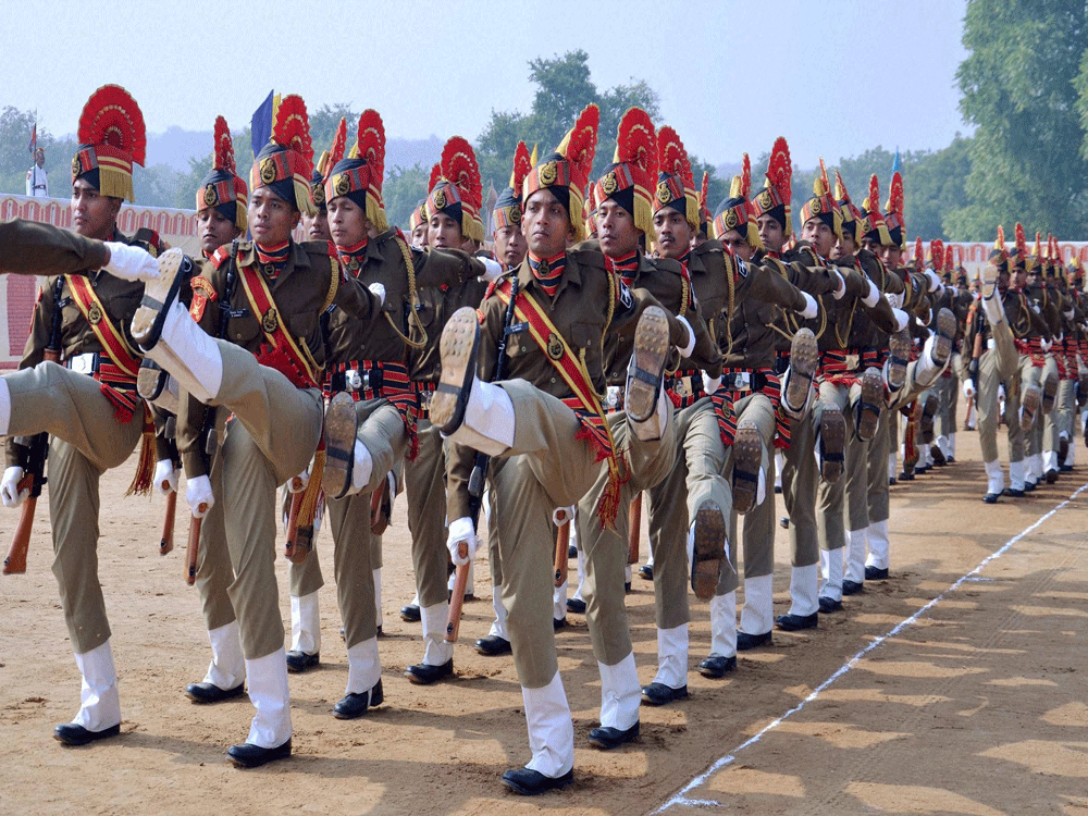  BSF cadets march at the passing out parade at the BSF training camp in Gurgaon on Friday. PTI Photo.
