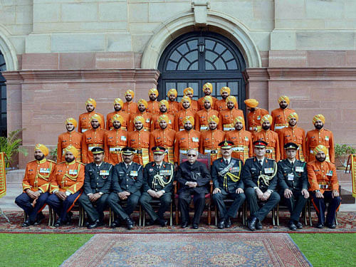 President Pranab Mukherjee meeting with the personnel of Tri Service Band Contingents (participants of the Beating Retreat Ceremony) & Provost Outriders of the Three Services at Rashtrapati Bhavan in New Delhi on Saturday. PTI Photo
