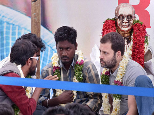 Congress Vice President Rahul Gandhi ineracts with students agitating over Rohith Vemula's death at University of Hyderabad on Saturday. PTI Photo
