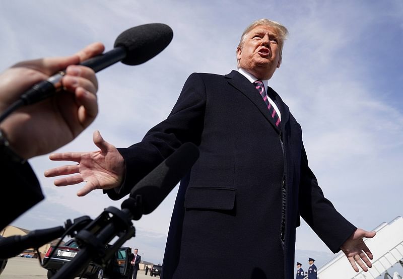 US President Donald Trump talks to reporters prior to boarding Air Force One as he departs Washington for campaign travel to California from Joint Base Andrews in Maryland, US. (Reuters Photo)
