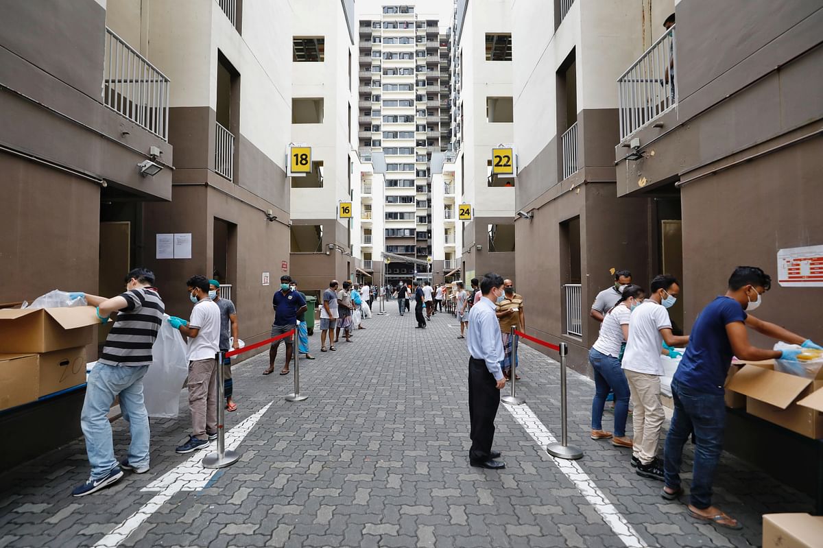 Food distribution takes place at Westlite Toh Guan dormitory, as the outbreak of the coronavirus disease (COVID-19) continues, in Singapore. (Reuters Photo)