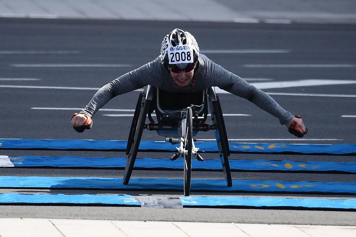 Christie Dawes of Australia finishes second in the women's wheelchair category of the Tokyo Marathon in Tokyo on March 1, 2020. (Photo by CHARLY TRIBALLEAU / AFP)