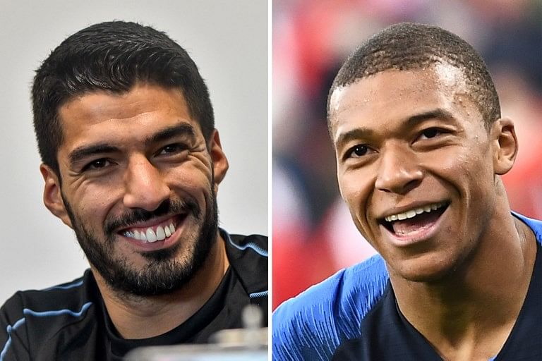 These photos show Uruguay's forward Luis Suarez (L) and France's forward Kylian Mbappe. France will play Uruguay in their Russia 2018 World Cup quarter-final football match at the Nizhny Novgorod Stadium in Nizhny Novgorod on July 6, 2018. Credit: Anne-Christine POUJOULAT, Martin BERNETTI / AFP
