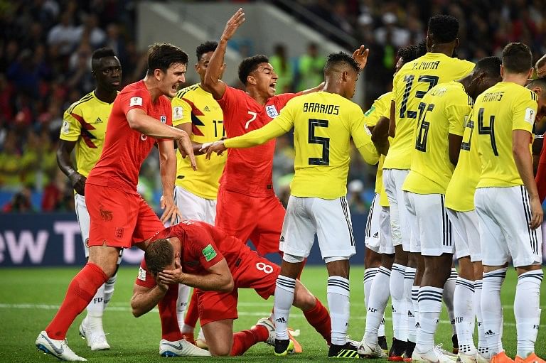 England's midfielder Jordan Henderson (C) is down after a clash with Colombia's midfielder Wilmar Barrios (4th R) during the Russia 2018 World Cup round of 16 football match between Colombia and England at the Spartak Stadium in Moscow on July 3, 2018.  FRANCK FIFE / AFP